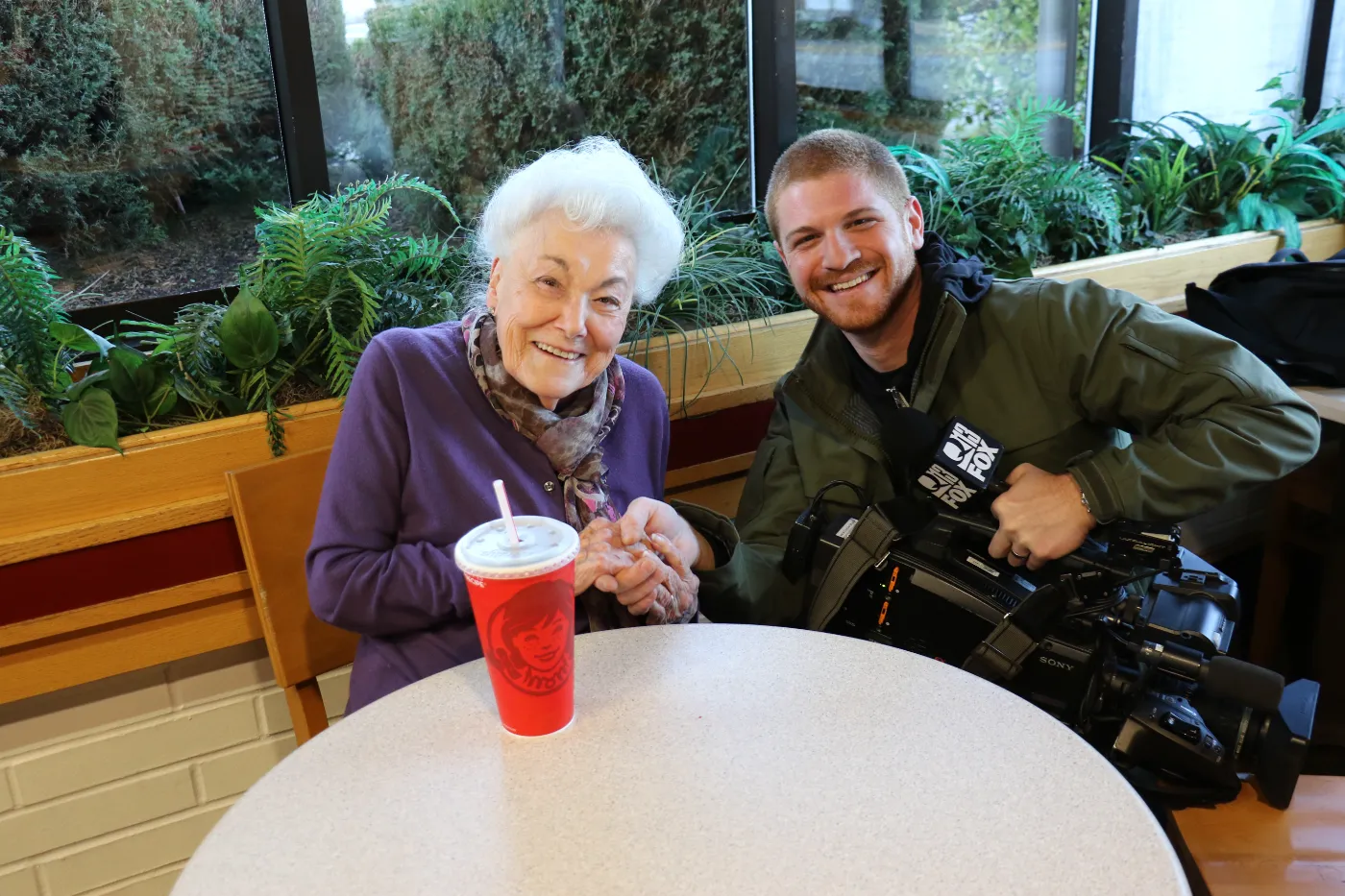Grandma Eileen smiling with a FOX news photographer